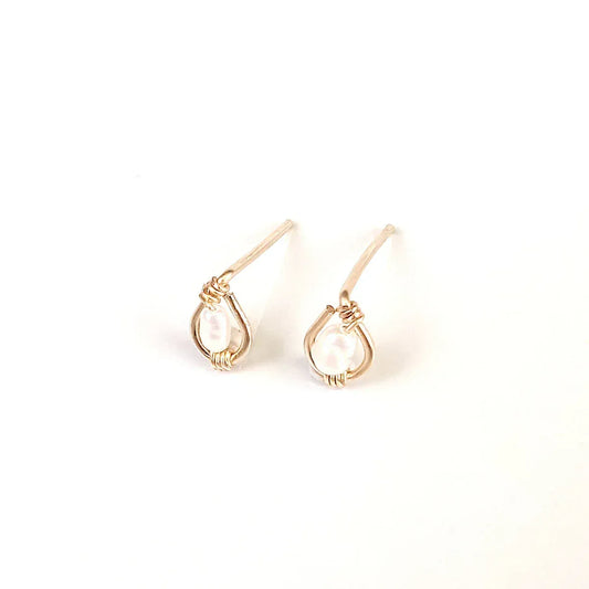 Freshwater rice pearls centered in 14k gold filled stud earring.