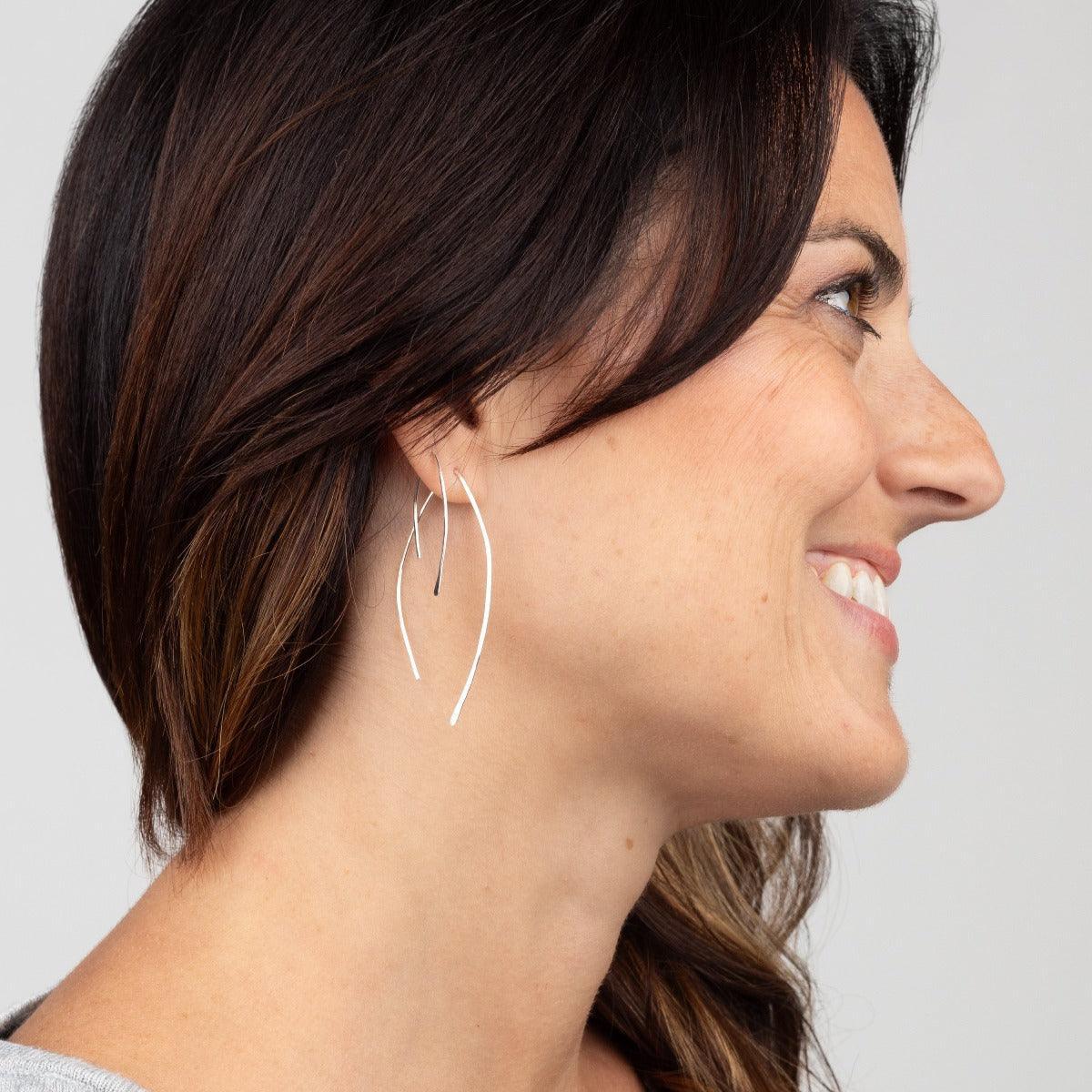 Sideview of woman wearing Qasioun Mini-Threader and Qasioun Minimalist Threader Earrings in Sterling Silver