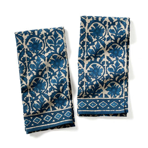 Two blue and white patterned towels on a white background Two blue and white patterned towels on a white background