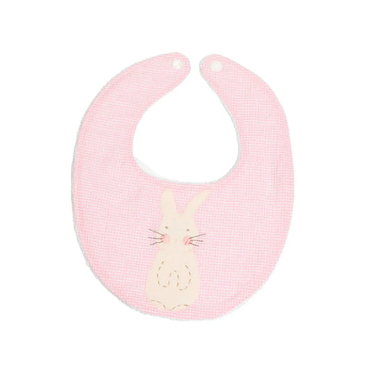 A pink baby bib with a handstitched bunny applique on the front, made of pink gingham fabric with a terry cloth back.
