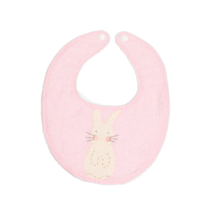 A pink baby bib with a handstitched bunny applique on the front, made of pink gingham fabric with a terry cloth back. A pink baby bib with a handstitched bunny applique on the front, made of pink gingham fabric with a terry cloth back.