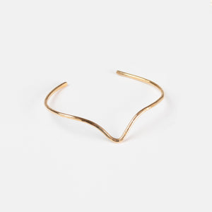 The Emily Brass Bangle on a white background, modern and classic. The Emily Brass Bangle on a white background, modern and classic.