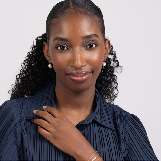 pair of 14 karat gold filled threader earrings with genuine freshwater pearls on a white background