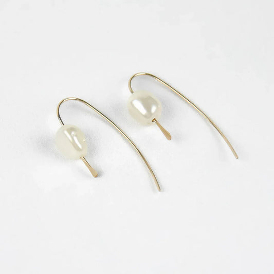pair of 14 karat gold filled threader earrings with genuine freshwater pearls on a white background