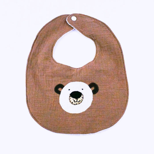 Brown bib with bear face design on a white background