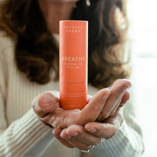 Thistle Farms Breathe essential oil roll-on Eucalyptus Peppermint "Breathe" blend.