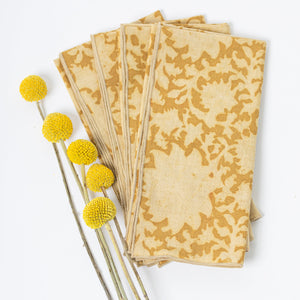Set of block printed cotton napkins with yellow flowers on a white background Set of block printed cotton napkins with yellow flowers on a white background