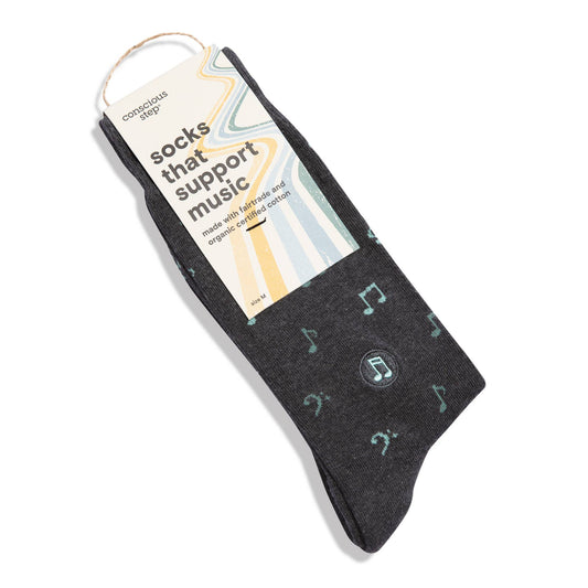 Dark gray socks with musical note pattern on a white background