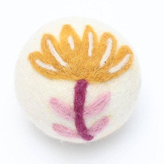 Yellow and pink flower dryer ball made with 100% organic wool. Fair Trade.