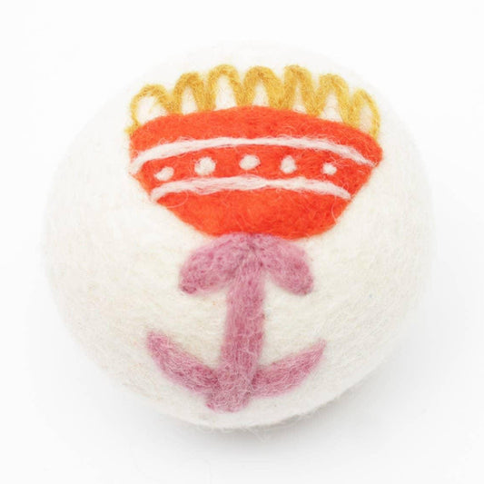 Orange flower dryer ball made with 100% organic wool. Fair Trade.
