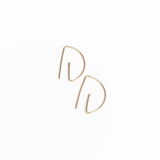 Close-up sideview of woman wearing earring stack with Half Moon Hammered Threader Earrings, Journey of Hope Huggie Earrings and Ear Cuff in 14k Gold Filled.