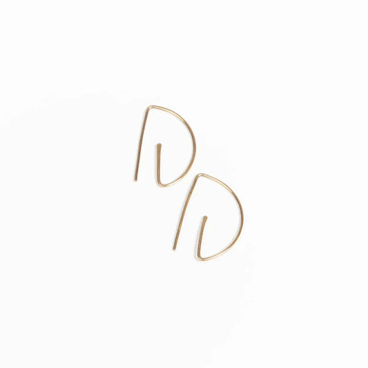 Close-up sideview of woman wearing earring stack with Half Moon Hammered Threader Earrings, Journey of Hope Huggie Earrings and Ear Cuff in 14k Gold Filled.