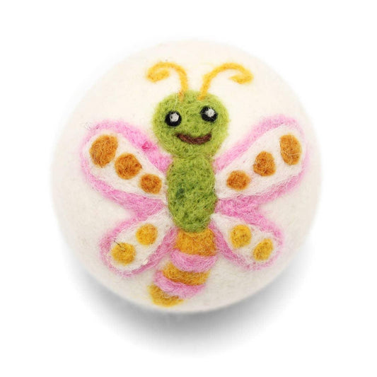 cute wool dryer ball with smiling butterfly design on white background