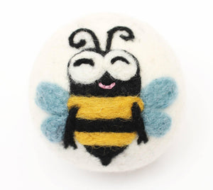 felted eco wool dryer ball with happy bee desigjn on a white background felted eco wool dryer ball with happy bee desigjn on a white background