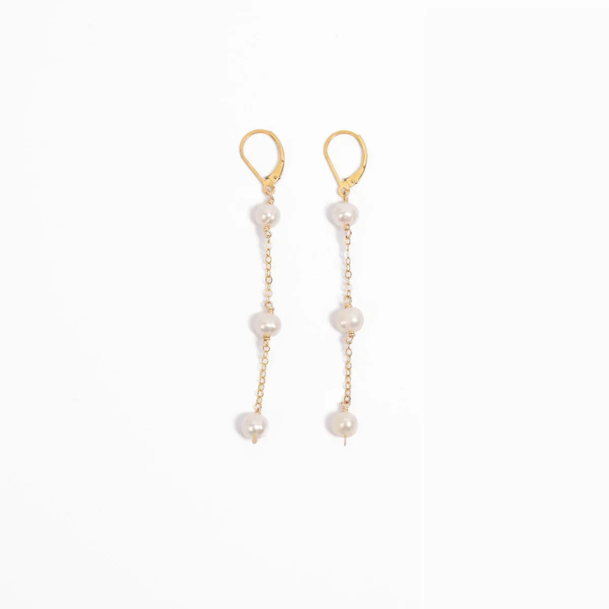 Freshwater pearl triple drop leverback earrings in 14k gold filled on a white background