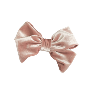 A rose gold velvet hair bow barrette. A rose gold velvet hair bow barrette.
