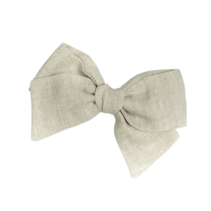 A handmade natural linen hair bow barrette. A handmade natural linen hair bow barrette.