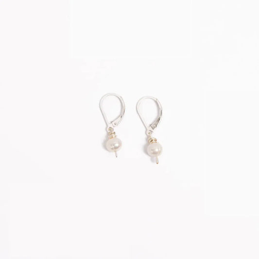 Woman wearing leverback Leeda Freshwater Pearl Drop Earring in Sterling Silver. Classic. Minimalist.