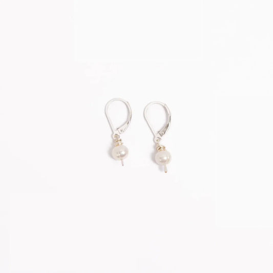 Woman wearing leverback Leeda Freshwater Pearl Drop Earring in Sterling Silver. Classic. Minimalist.