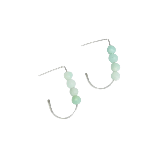 Woman in a black top wearing Amazonite J Hoop Earrings in Sterling Silver. Minimalist.