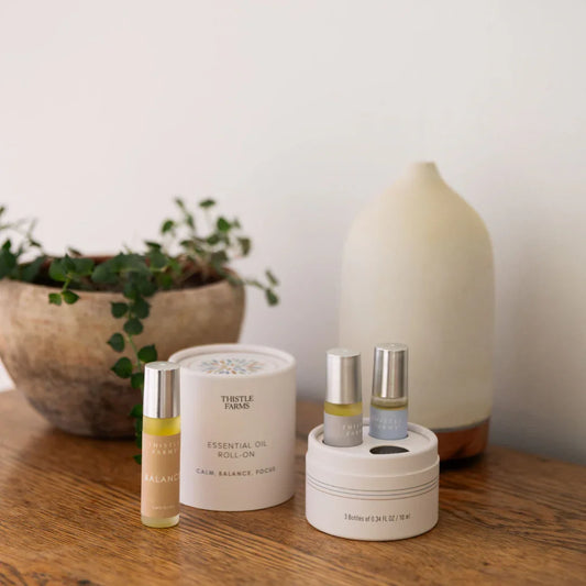 Thistle Farms Rest essential oil roll-on Trio for Calm, Balance and Focus.