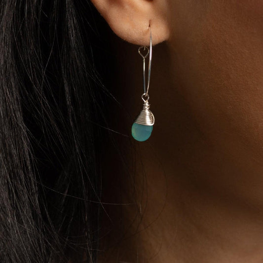 Close-up of ear with Aqua Chalcedony Hoop Earrings in Sterling Silver, classic and timeless design.