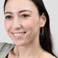 A smiling woman wearing the Mai Blue Beaded Threader Earrings in 14k Gold Filled.