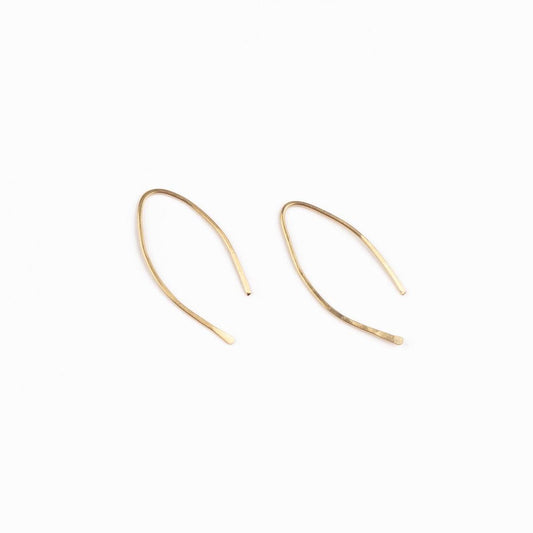 A woman wearing Qasioun Mini-Threader Earrings in 14k gold filled, which are small, lightweight earrings with a minimalist design.
