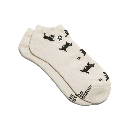 Beige ankle socks with black cat illustrations on a white background