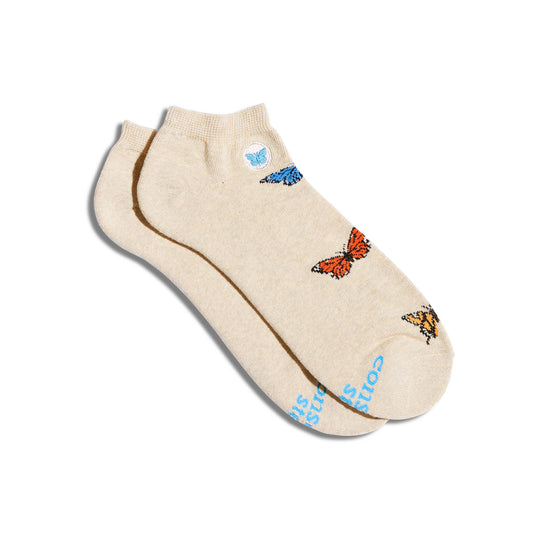 Beige ankle socks with butterfly designs on a white background