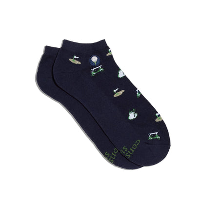 Navy blue socks with green golf designs on a white background