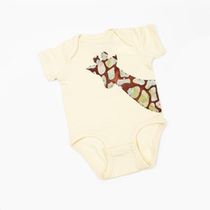 A natural baby onesie with hand-appliquéd giraffe design on the front.