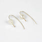pair of 14 karat gold filled threader earrings with genuine freshwater pearls on a white background