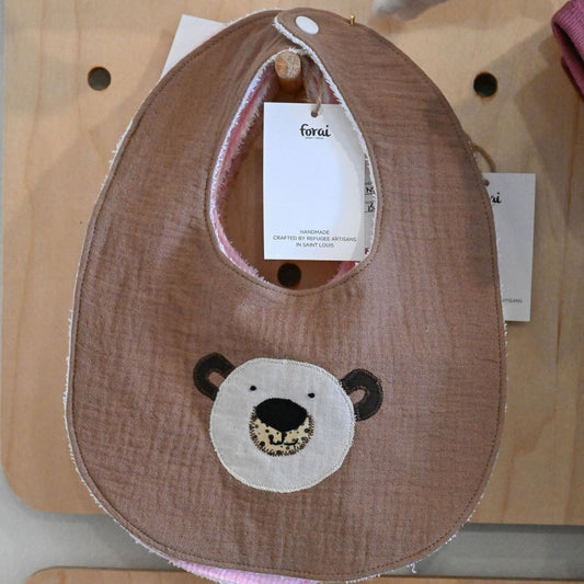 Brown bib with bear face design on a white background