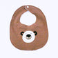 Brown bib with bear face design on a white background