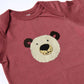 Maroon baby onesie with a bear face design on a white background