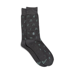 Dark gray socks with musical note pattern on a white background