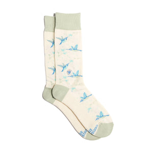 Cream-colored crew socks with hummingbirds on a white background