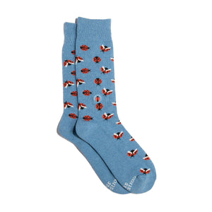 Blue crew socks with ladybug pattern on a white background