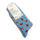 Pack of blue crew socks with ladybug pattern and packaging that says socks that protect pollinators on a white background