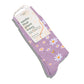 Purple socks with floral pattern on packaging, brand 'conscious step' visible