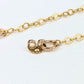 close up of dainty chain earring jackets showing the chain linked to an earring back