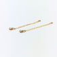 two gold chains attached to 14 karat gold filled earring backs