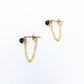 a pair of gold stud earrings with dainty chain earring jackets attached to form loops.