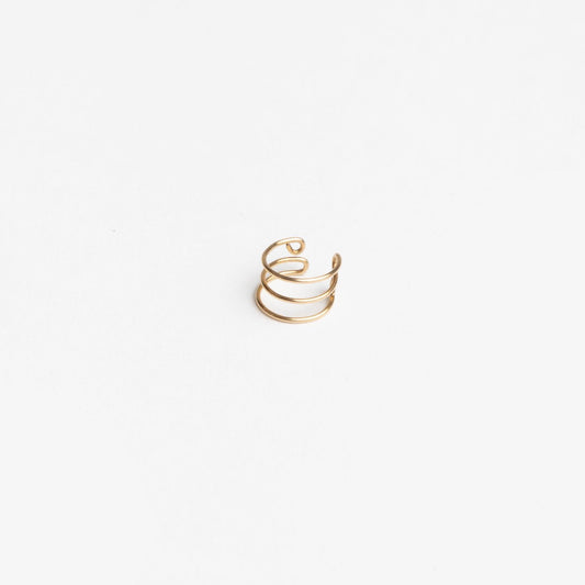 Woman wearing Journey of Hope Ear Cuff in 14k gold filled paired with Journey of Hope Huggie Earring.