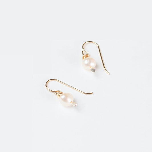 Sideview of woman wearing the Leeda Freshwater Pearl Earrings and Necklace in 14k Gold Filled