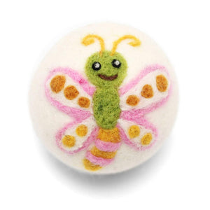 cute wool dryer ball with smiling butterfly design on white background