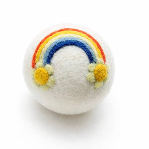 White felt ball with a rainbow and flowers on a white background