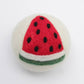 eco friendly wool dryer ball with watermelon design on a white background