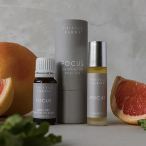 Thistle Farms Focus essential oil roll-on and pure essential oil with zesty mint and citrus notes 